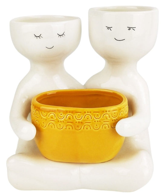 Friends holding a pot planter Mustard