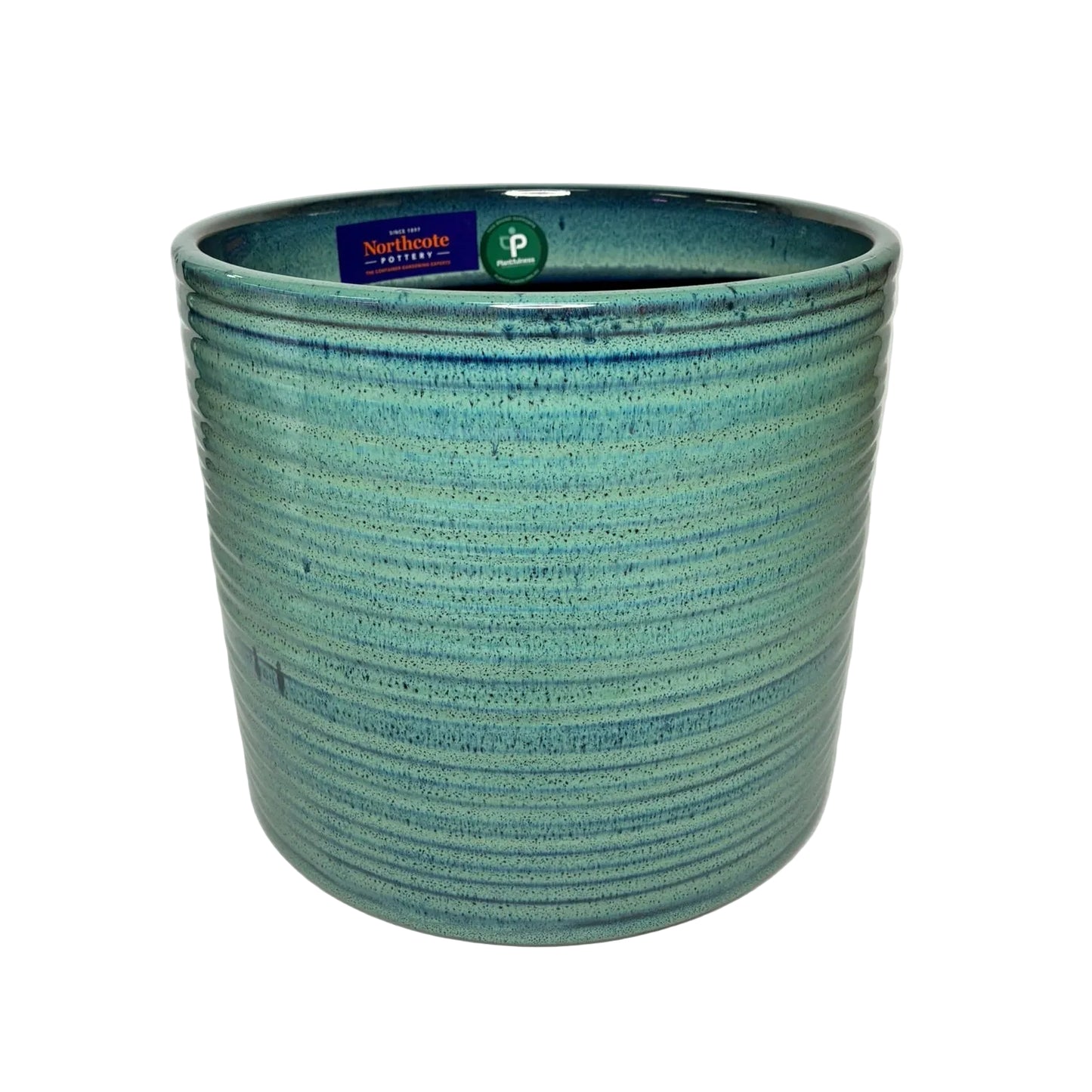 A handmade ceramic planter with a textured, ribbed exterior and a glossy teal-blue glaze, featuring a visible Northwoods brand tag inside the rim.
