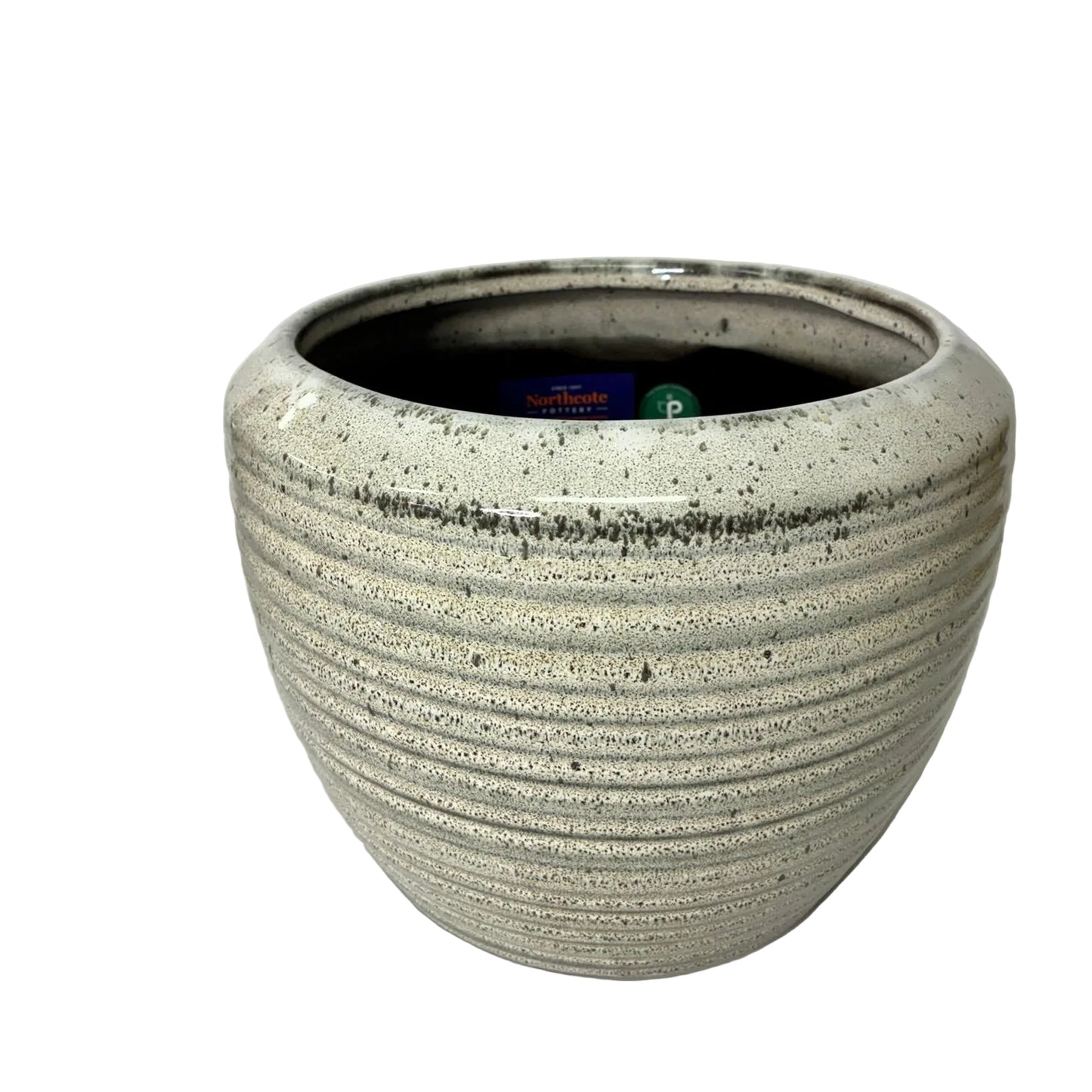 A round, ribbed ceramic planter pot with a speckled off-white glaze and a dark interior, shown on a white surface against a white background.